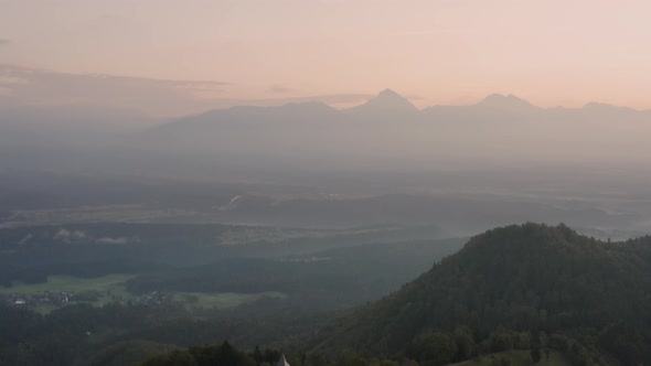 Aerial view over Alps and Church St. Primoz