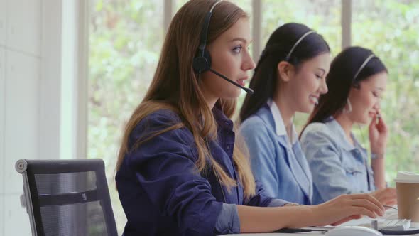 Customer Support Agent or Call Center with Headset Talking to Customer on Phone alt