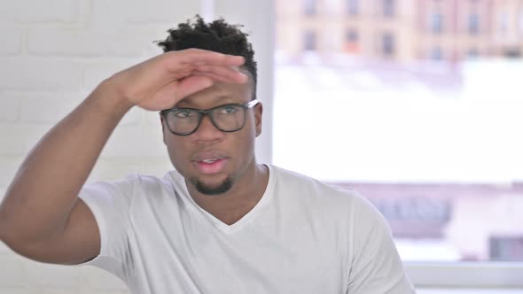 Portrait of Casual African Man Searching for Opportunity  alt