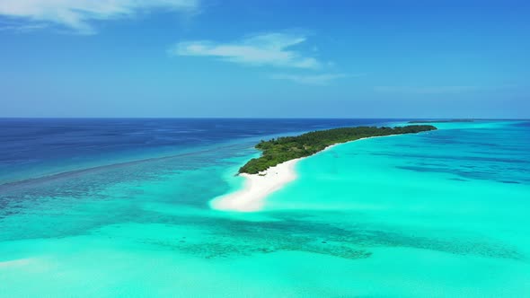Wide above copy space shot of a white sand paradise beach and turquoise sea background in high resol alt