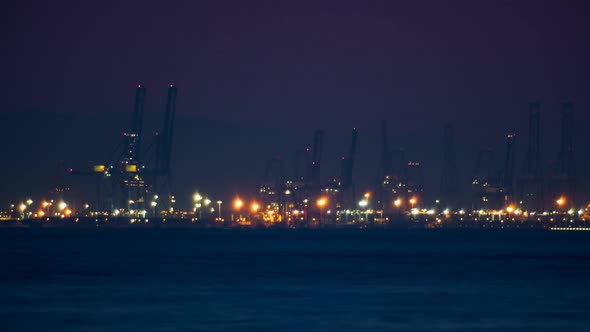 Time Lapse of Commercial Dock with Cranes at Night
