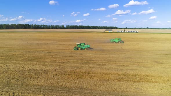 Aerial View of Combine Harvester on Wheat Field