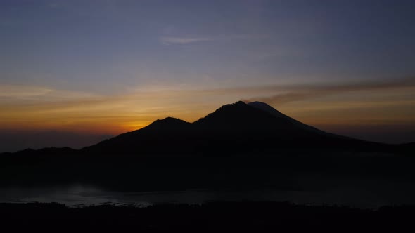 Timelapse View of Sunrise Over the Volcano From Mount Batur.