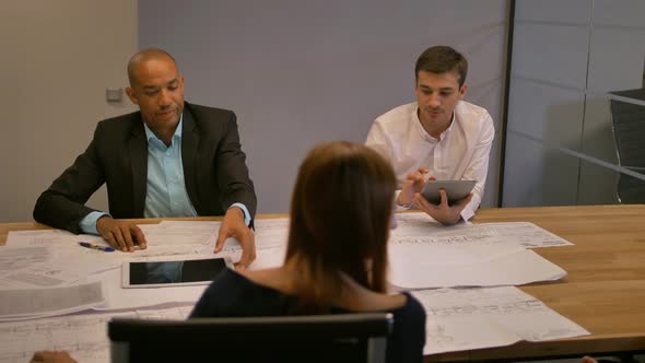 Confident Entrepreneur in Virtual Reality Glasses. Group of Young Engineers Working. alt