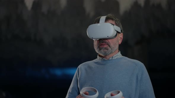 Man in VR Headset Standing in Ice Cave on the Right alt