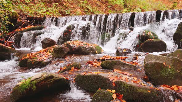 Large Boulders Overgrown with Moss at Waterfall alt