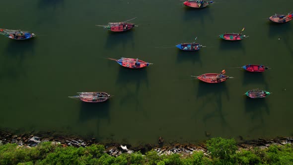 Many fishing boats on the coast beside the mountains, beautiful sea area in Thailand. alt