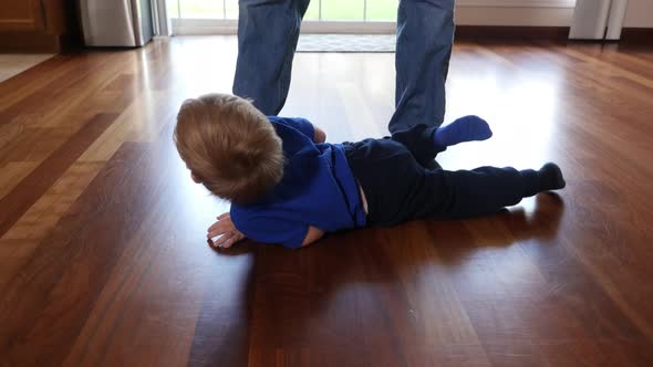 Father and Son at home tickling and playing