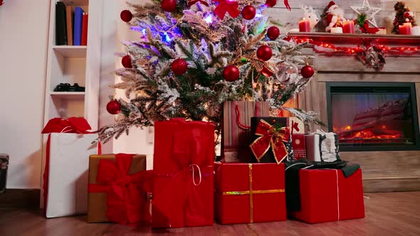 Gift Boxes Under Christmas Tree Beautifuly Decorated alt