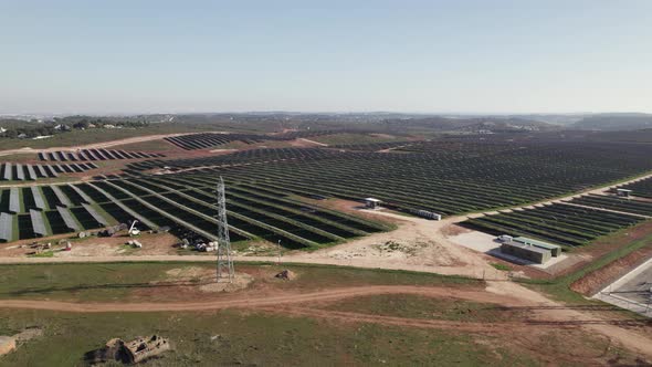 Solar panels installed on big solar farm in Algarve, Portugal - drone pan