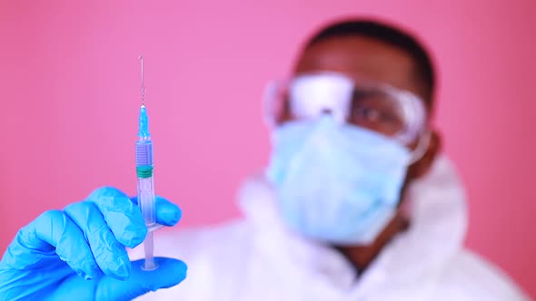 Corona Virus SARSCoV2 Vaccination Concept  Man in Pink Studio Wall Background alt