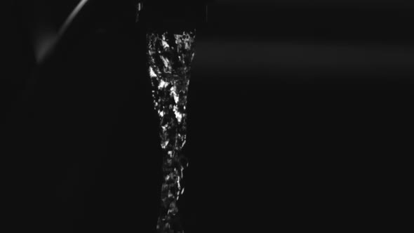 Water pouring from a faucet in ultra slow motion  alt