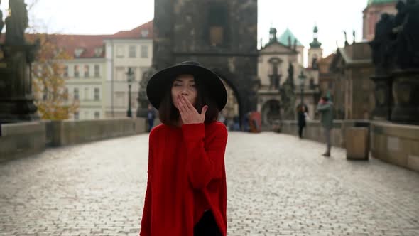 Happy Asian Woman Tourist Walking on Charles Bridge in Prague alt