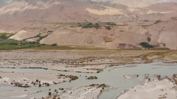 View of the Pamir, Afghanistan and Panj River Along the Wakhan Corridor. alt
