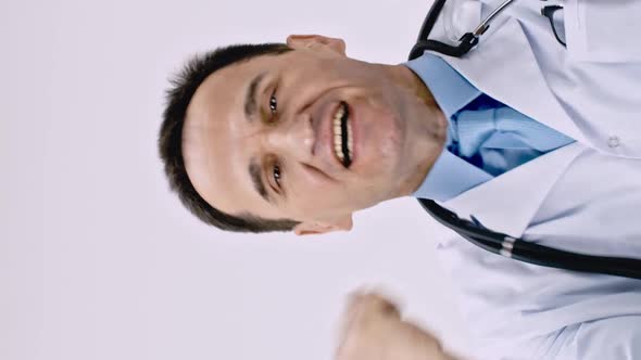 Vertical Shot Middle Aged Caucasian Doctor Expressively and Happily Joy Raises His Fists