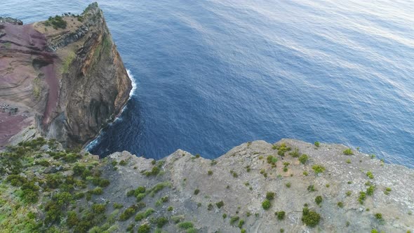 Aerial View Of Rocky Cliff On Ocean Coast