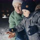 Mother and Son Playing at Winter Festival Snowing - VideoHive Item for Sale