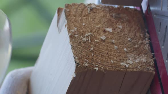 Vertical Shot Annual Wood Rings Wood Appear While Carpenter Cuts Off Wooden Post on Mitre Saw