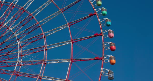 Ferris Wheel Over Blue Sky alt