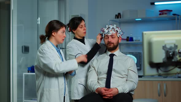 Neurological Researchers Explaning Treatment Result alt