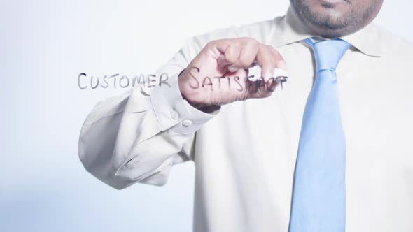 Asian Businessman Writes Customer Satisfaction 