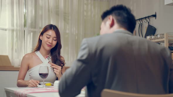 Asian young couple having dinner to celebrate valentine's day together. alt