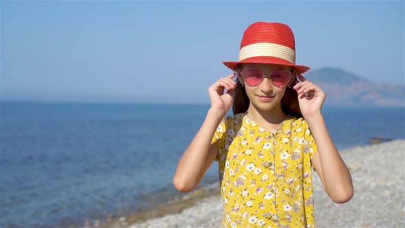 Cute Little Girl at Beach During Summer Vacation