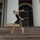 Wide Shot of Slim Gorgeous Woman in Black Dress and Yellow Pointes Bending and Moving Standing on - VideoHive Item for Sale