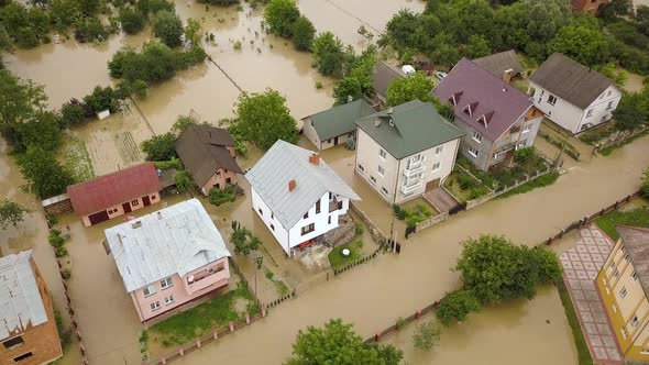 Aerial view of flooded houses with dirty water of Dnister river in Halych town, western Ukraine alt