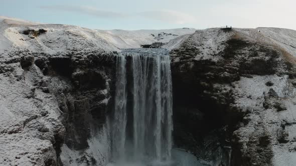 Aerial View of Skogafoss Waterfall During Sunrise. Iceland in Early Spring