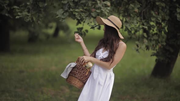 Cheerful Woman Biting Off a Piece of Bun