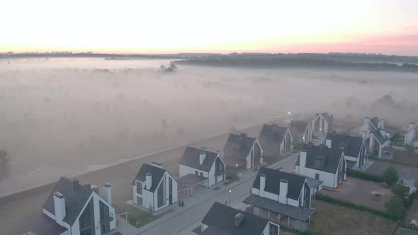 Townhouse at Dawn with Fog That Hangs in Layers