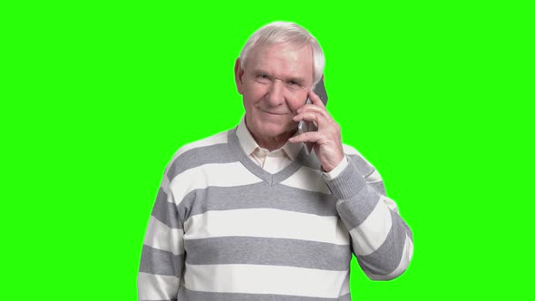 Grandpa Talking on Phone with His Family. alt