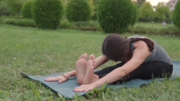 Female Yoga Instructor Seated Forward Fold Paschimottanasana Seated Yoga Pose Flexibility Mobility