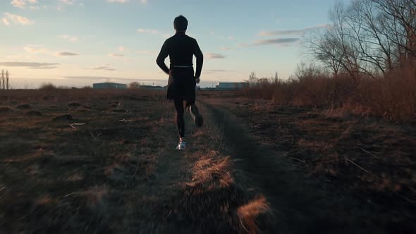 Man Run At Sunset. Man Running. Runner Male Jogging At Sunrise. Running Man Exercising On Trail. alt