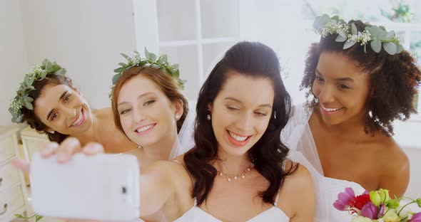 Bridesmaids and bride making pout while taking a selfie4K 4k alt
