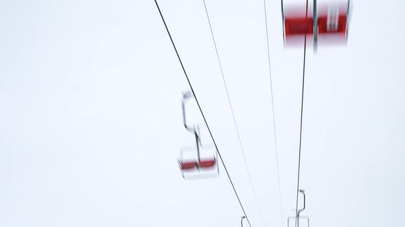 Ski Lift Skiers and Snowboarders Resort in Carpatian Mountains Time Lapse alt