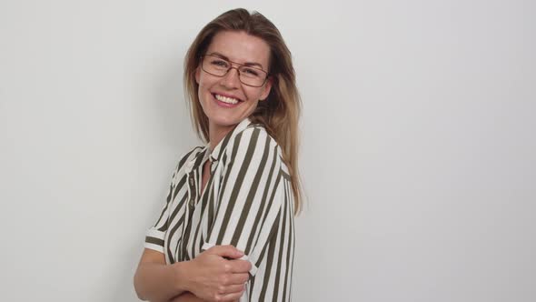 Woman in Striped Shirt and Glasses