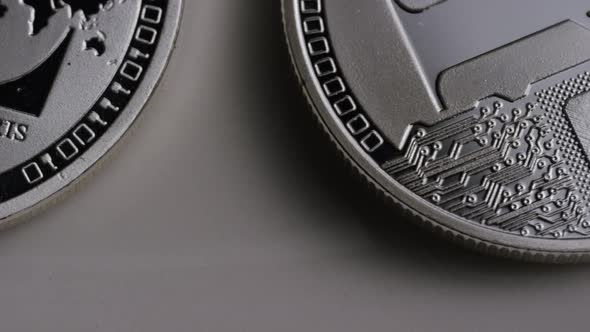 Rotating shot of Litecoin Bitcoins (digital cryptocurrency) - BITCOIN LITECOIN 0111 alt