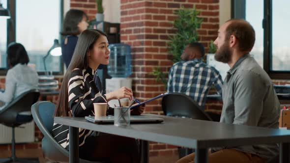 HR Employee Interviewing Male Applicant About Work Experience alt