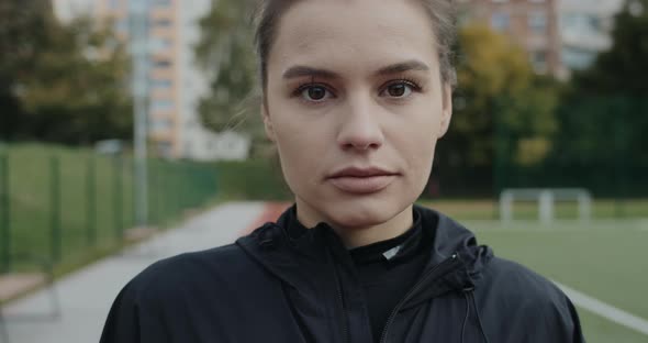 Close Up of Charming Young Woman Raising Eyes and Looking To Camera alt