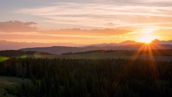 Time lapse of layers over the Idaho landscape during colorful sunset alt