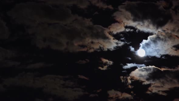 Mysterious Night Sky with Full Moon Dramatic Clouds in the Moonlight From Full Moon alt