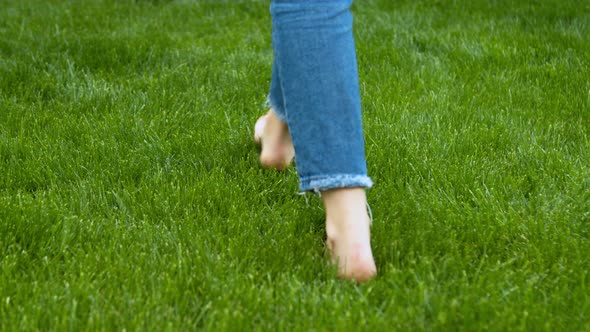 Woman Stepping on Mown Lawn