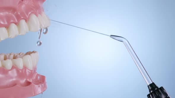 Water Flosser Cleaning Teeth on Blue alt