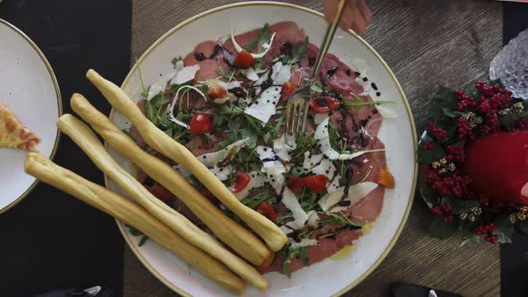 Delicious appetizer at restaurant with prosciutto alt