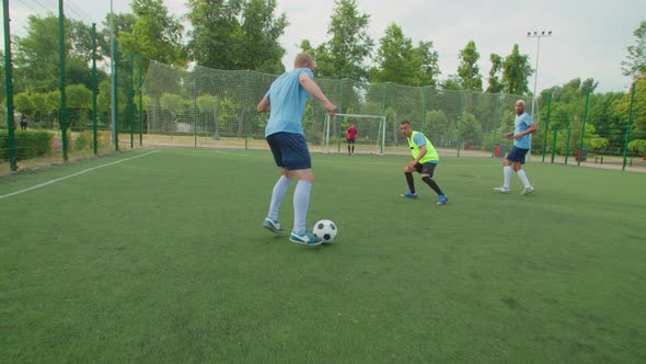 Skilled Defender Doing Sliding Tackle in Under Striker's Feet Outdoors alt