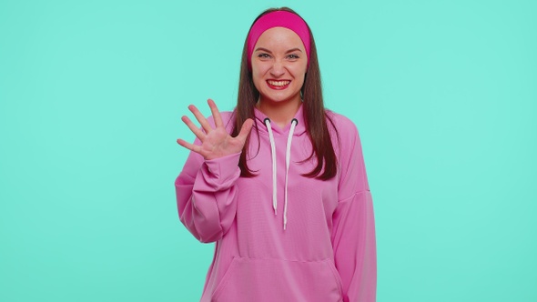 Countdown to Win Celebration Cheerful Girl 20s in Hoodie Counting in Reverse Order From Five to One alt