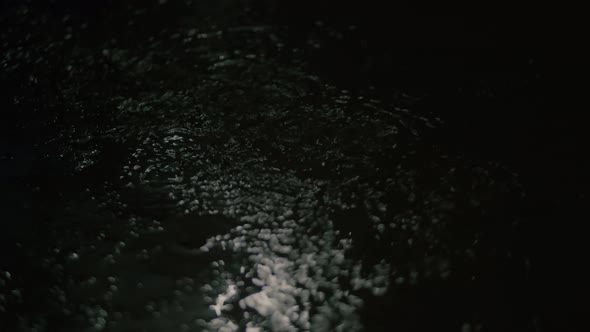 Closeup at Night Drops of Summer or Autumn Rain Fall on the Asphalt in the City Near Residential alt