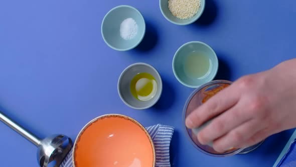 Vertical Flat Lay Video Chef Adds Ingredients of the Humus with Nutt and Carrot to the Blender Bowl